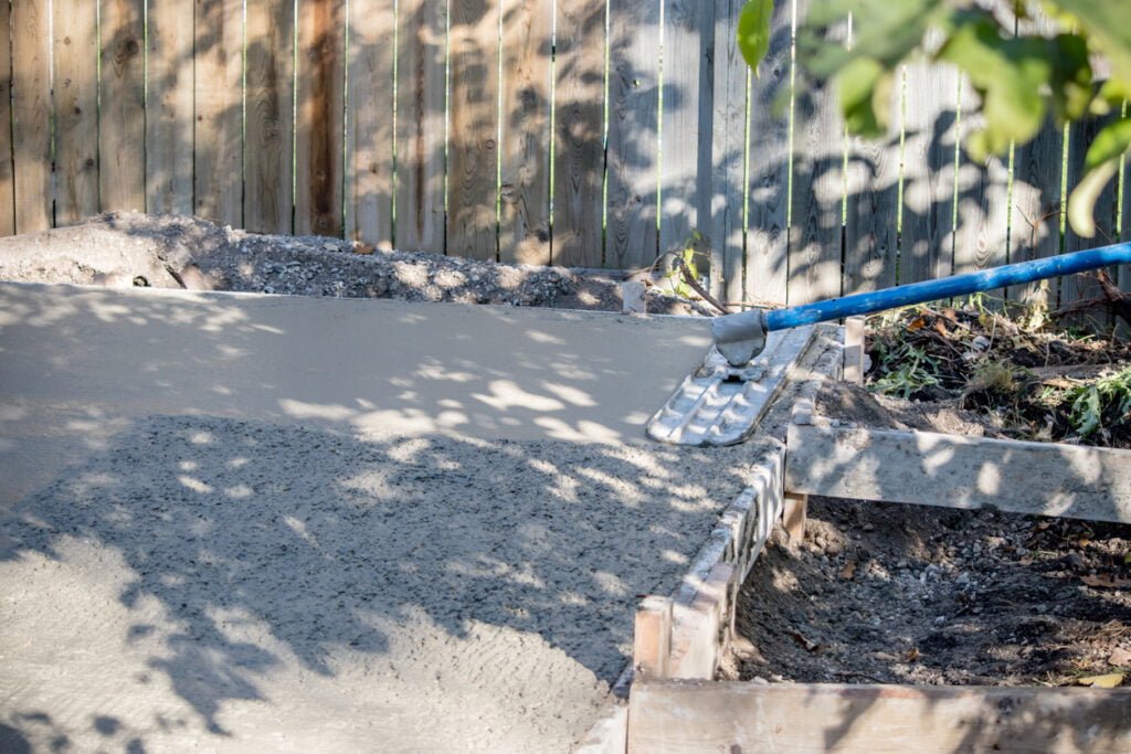 NDIS builders in Melbourne concreting flat garden path, creating even ground and removing tripping hazards