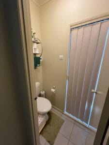 Photo of a toilet room , showing lack of space to move for a person with a disability